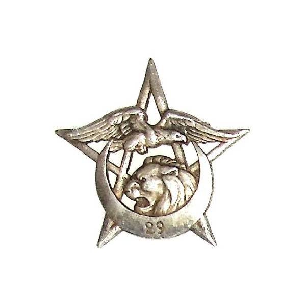 29° Régiment de Tirailleurs Algériens  Levant , croissant, lion et aigle sur étoile à fond évidé, anneaux ressoudés